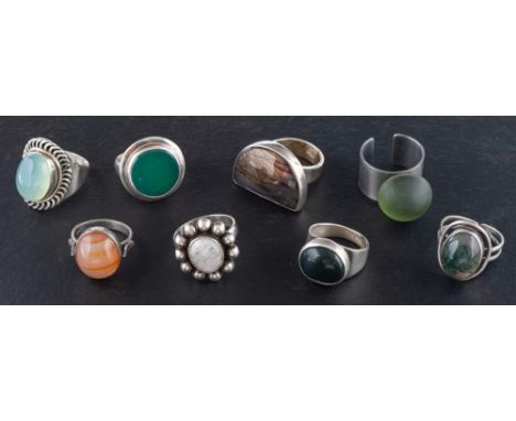 Eight gemset rings,: including moss agate, chalcedony, agate, moonstone, carnelian and spectrolite, two rings stamped '925', 