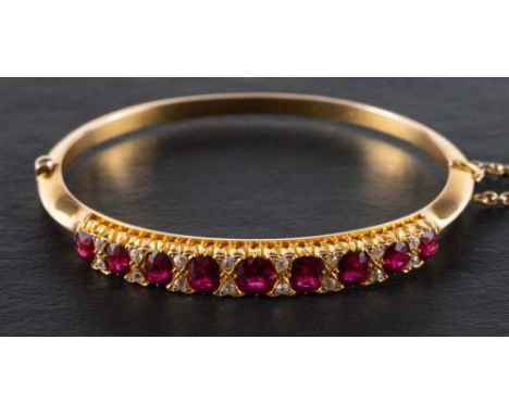 A hinged ruby and single-cut diamond bangle,: estimated total ruby weight ca. 5cts, estimated total diamond weight ca. 0.15ct