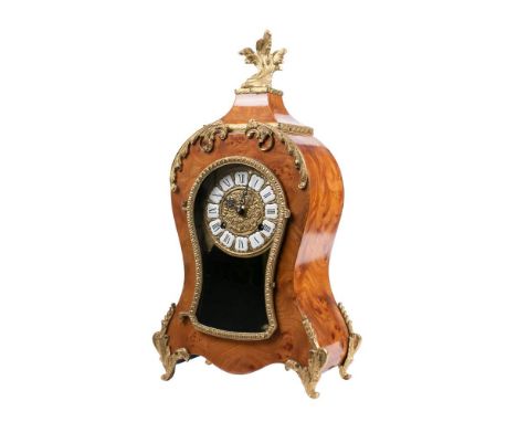 Lauris, a contemporary burr walnut mantel clock in the 19th century style: the eight-day duration movement striking on a bell