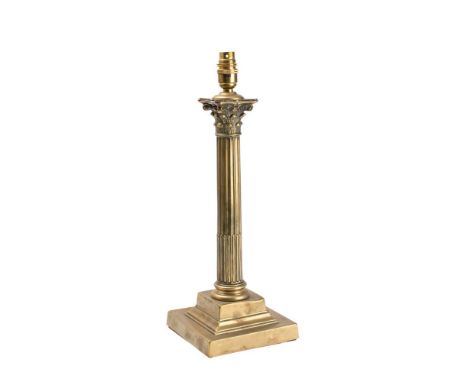 A brass Corinthian column table lamp: with foliate capitol on a stop fluted column and stepped square base, 44cm high.