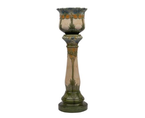 A Burmantofts Art Nouveau faience jardinere and stand: moulded with flowers, scrolling stalks and foliage, impressed 'Burmant