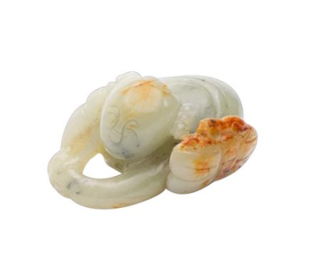 A Chinese celadon jade carving: of a boy with a butterfly, the stone with russet inclusions, 5cm.