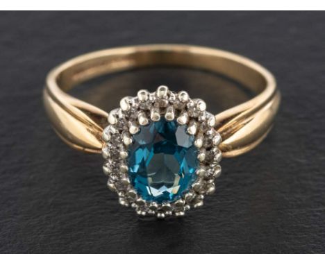 A 9ct gold, blue topaz and single-cut diamond cluster ring,: estimated topaz weight ca. 1.50cts, with hallmarks for London, 1