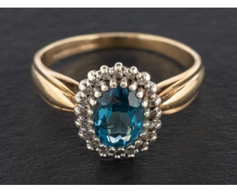 A 9ct gold, blue topaz and single-cut diamond cluster ring,: estimated topaz weight ca. 1.50cts, with hallmarks for London, 1