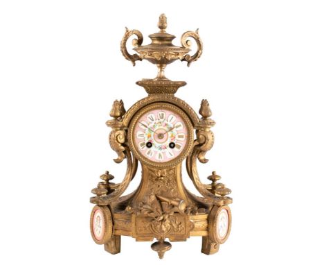 A gilt-metal and porcelain French mantel clock: the eight-day duration movement striking the hours and half-hours on a bell w