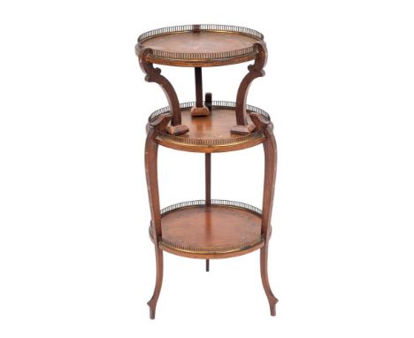 An Edwardian painted mahogany etagere, early 20th century,: the three circular shelves all with floral ribbonwork borders wit