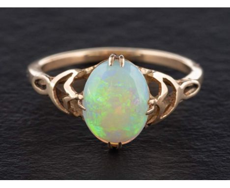 A cabochon-cut opal ring,: length of ring head ca. 2cm, ring size O, total weight ca. 2.1gms. 