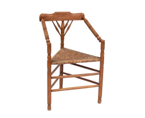 Two Dutch bobbin-turned hardwood elbow chairs, 19th century,: with rectilinear rush seats; the larger 94cm high, 56cm wide; a