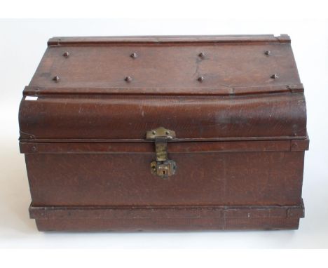 A large 'wood effect' twin-handled tin travelling trunk, with stud and banding detail, 76 x 55cm 
