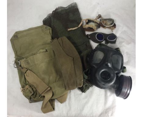 A British military chemical gas mask, together with canvas bag, cleaning clothes, scrim, WW2 army cap, pilots goggles and pai