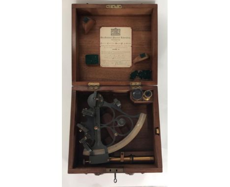 An ebonised metal and brass sextant by Kelvin, White &amp; Hutton, in fitted walnut hinged square box with certification from