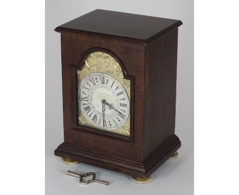 A mahogany cased Silver Jubilee mantel clock by Charles Frodsham, with silver gilt arch depicting a crown and '1977', silver 