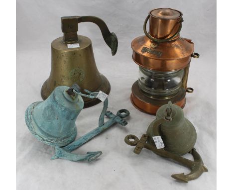 A copper ship's masthead lamp, approx. 31cm high, together with three various ship's bells with mounting plaques, one marked 