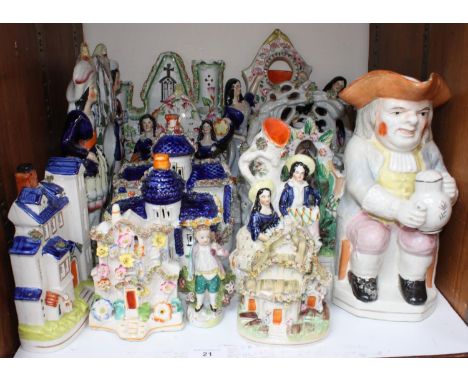 SECTION 21.  A shelf of ceramics including Staffordshire flatback figures and character jugs etc. 