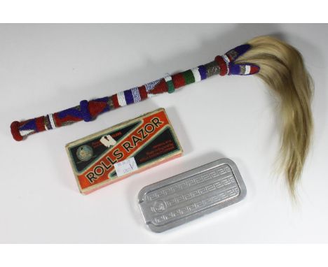 A West-African beadwork fly-whisk, together with a vintage, boxed 'Rolls Razor' 