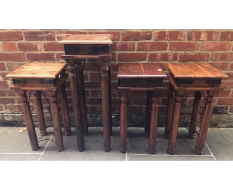 Three Indian wooden jardiniere/lamp tables with black metal stud and arch detail, 30cm diam, together with a taller example m