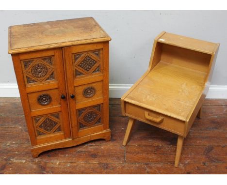 A small oak cupboard with two carved panel doors enclosing shelves, raised on shaped bracket feet, 51cm wide, together with a