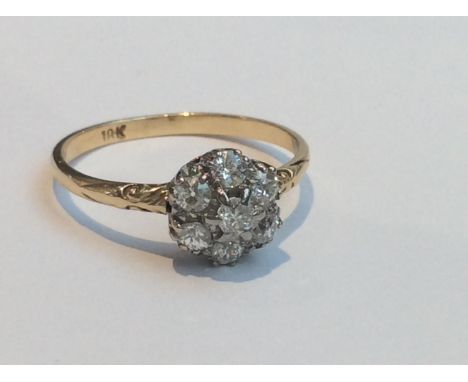 An 18ct yellow gold and diamond cluster ring, claw and milligrain set with 7x Old Victorian Cut diamonds, estimated total dia