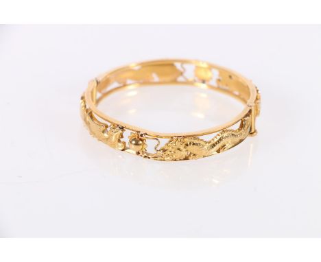 Chinese gold bangle with pierced dragon chasing flamming pearl design, two character marks to interior, 37.74g with jewellers