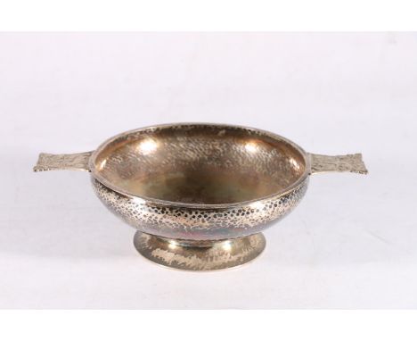 George V sterling silver twin handled bowl, the hammered body flanked by Fox and foliate decorated handles, George Edwards an