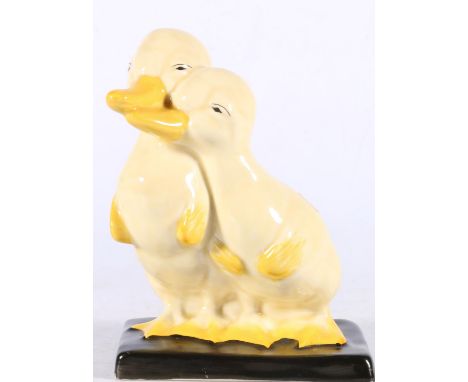 Clarice Cliff for Wilkinson Ltd, a pottery model of two ducklings, black stamp, 15cm tall.  Some light crazing in places. Gen