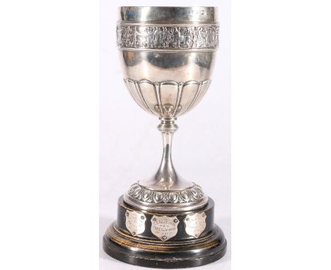 Victorian sterling silver prize cup, on hardwood stand, the cup with chased border of figures, Elkington &amp; Co., Birmingha