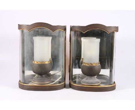 A pair of electric wall lanterns, probably by Colefax and Fowler, of demi lune shape with curved glass fronts holding egg cup