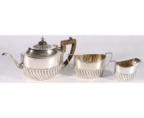 Victorian sterling silver three piece bachelor's tea service, with reeded body, Harrison Brother &amp; Howson, Sheffield 1896