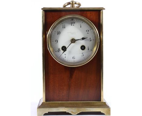 Antique brass and mahogany mantle clock, the white enamelled dial with Arabic numerals bearing the retailers name Maple &amp;