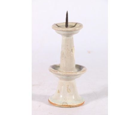 A Chinese early ceramic candle pricket with two tiers decorated with a pale blue green&nbsp; glaze, 15cm&nbsp; 