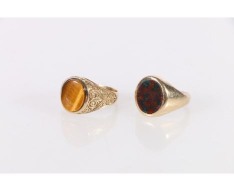 9ct gold bloodstone set signet ring, Birmingham, maker Henry Griffin and Sons, size M , 6.3g and a 9ct gold tigers eye set dr