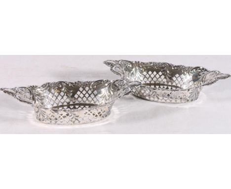 Pair of sterling silver pierced bonbon dishes, with foliate decoration, maker A &amp; J Z, Birmingham, 1897, 15.5cm long, 93.
