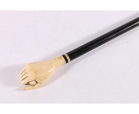 Ebony and carved marine? ivory walking stick, the handle in the form of a hand holding an oval ball, 92cm long. 