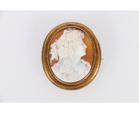 Gold framed cameo brooch with left facing portrait female, possibly in 15ct gold, 17.6 grams gross. 