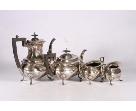 George V sterling silver four piece tea service, with wavy edge rim, on cabriole pad supports, Walker &amp; Hall, Sheffield, 