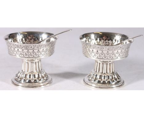 Pair of George V sterling silver salts on fluted bases with non matching silver and EPNS spoons, S.Blancbensee and Son Ltd, B