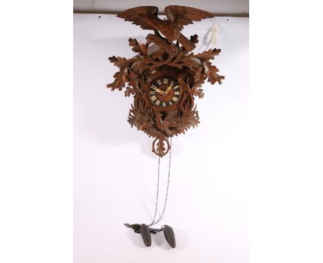 Good German/Swiss Black Forest type cuckoo wall clock of large proportions, decorated with bird and oak leaf surmount, 63cm t