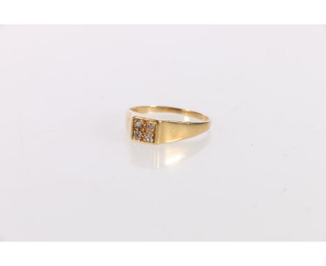 Unhallmarked yellow metal ring set with a 2x2 matrix of four small diamonds, ring size T, 3.7g gross.&nbsp; 