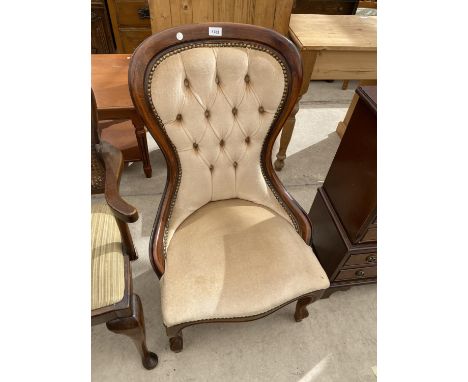 A MAHOGANY BUTTON BACK NURSING CHAIR 