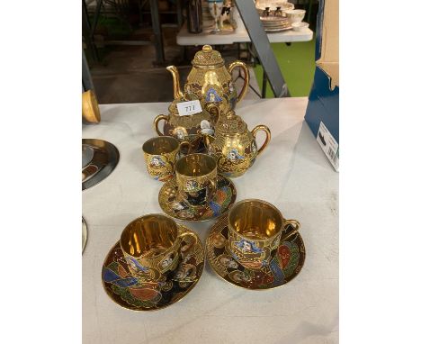 A VINTAGE SAMURAI JAPANESE TEA SET COMPRISING OF A TEAPOT, MILK JUG, SUGAR BOWL AND THREE CUPS AND SAUCERS AND A FURTHER CUP 