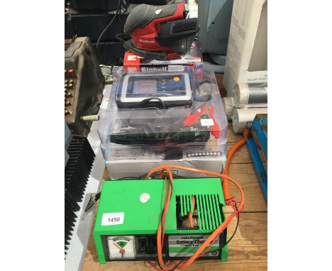 A BATTERY CHARGER, A RING SMART BATTERY CHARGER WITH ANALYZER AND SANDER 