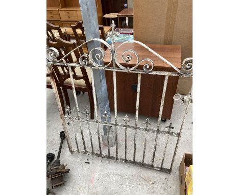 A WHITE WROUGHT IRON GATE 