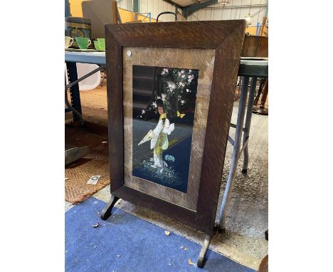 A FREDRICK RHEAD PAINTED FIRE SCREEN DEPICTING AN ORIENTAL SCENE 
