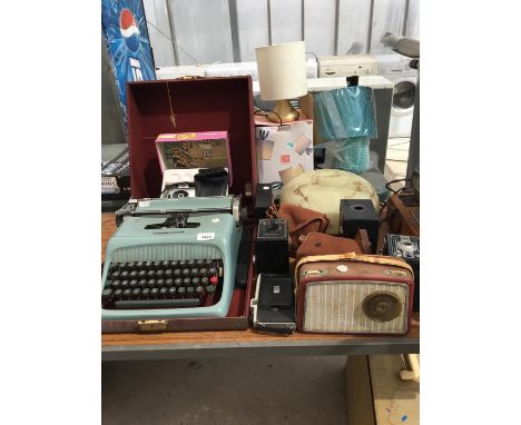A CASED OLIVETTI TYPEWRITER WITH BROWNIE CAMERAS AND LIGHT FITTING 