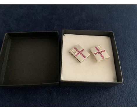 A PAIR OF BOXED SILVER AND RUBY CUFFLINKS 