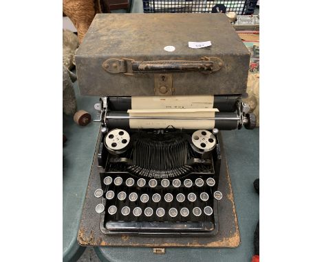 A VINTAGE CASED TYPEWRITER 