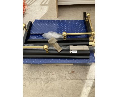 A BLACK AND BRASS FIRE SURROUND 