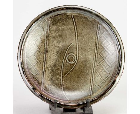 † MICHAEL CARDEW (1901-1983) for Wenford Bridge Pottery; a stoneware plate decorated with an eye motif, impressed MC and pott