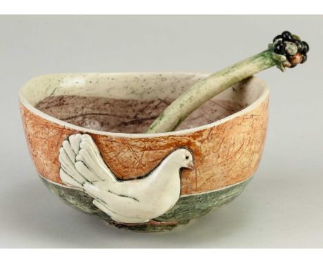 † ANNA LAMBERT (born 1957); an oval earthenware bowl decorated with a sprigged chicken and a small ladle, incised AVL mark, d