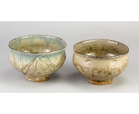 JIM MALONE (born 1946); a stoneware bowl covered in green ash glaze with impressed and incised decoration and running cobalt 